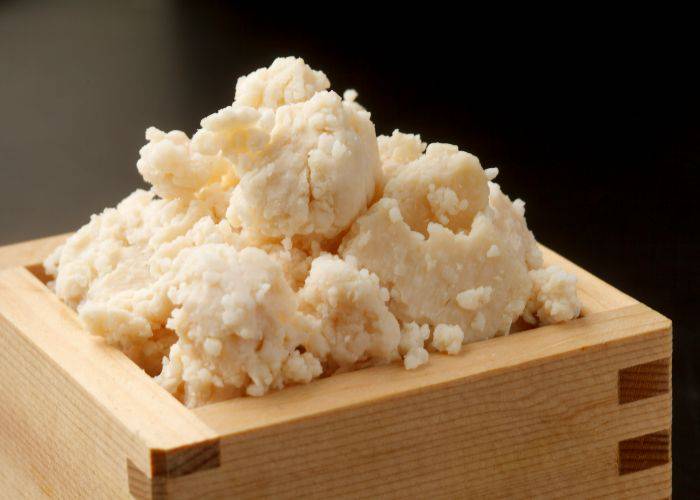 A traditional Japanese serving box of sake lees, the byproduct of filtering sake.